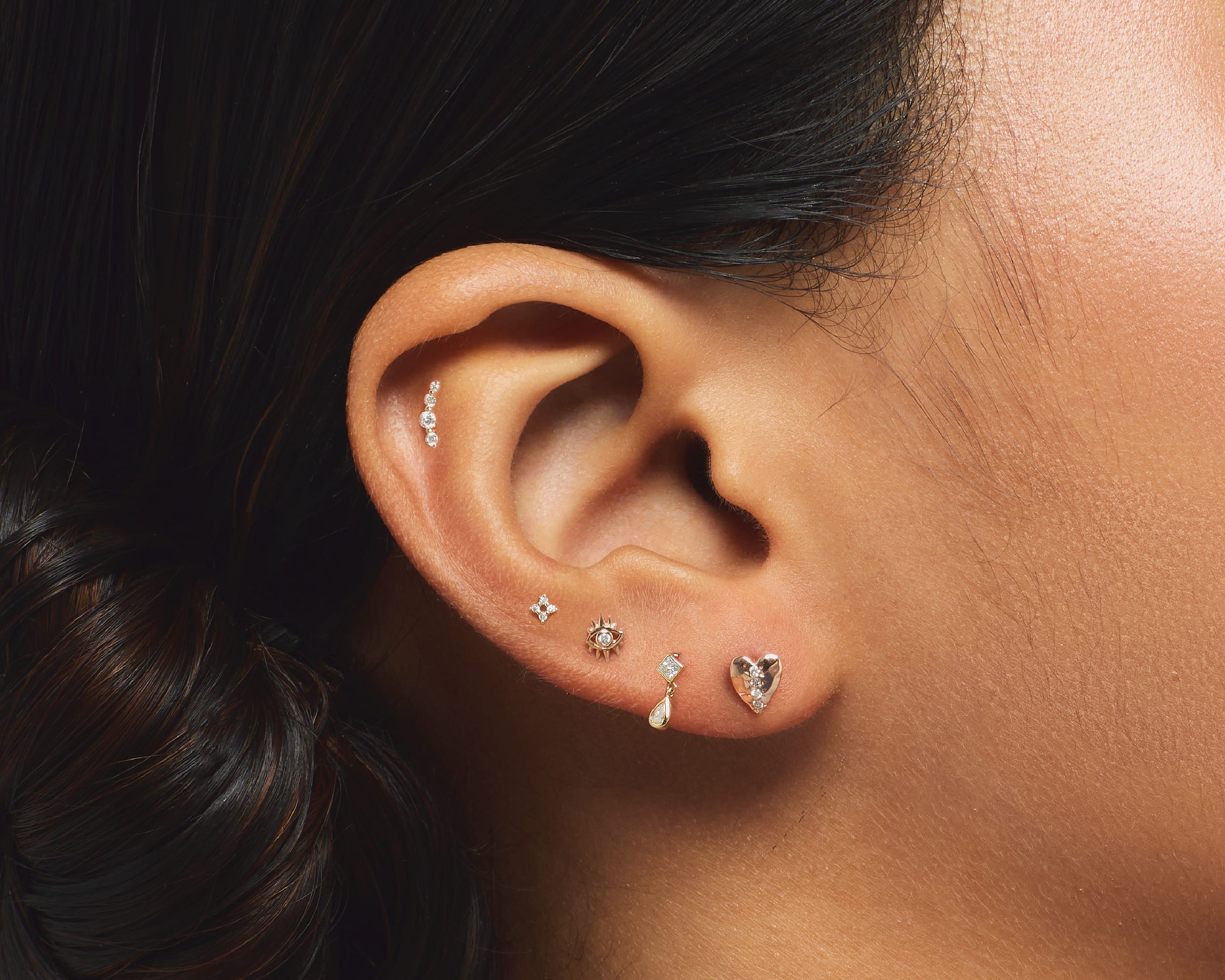 Luxury Piercings: The Advantages of 14K Gold Flatback Earrings for Comfort, Safety, and Style